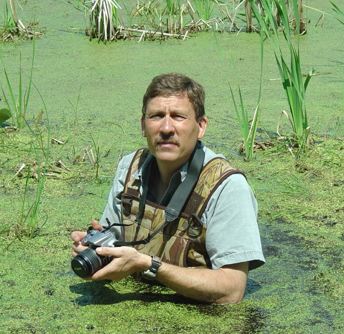 John Haack photographing wetland